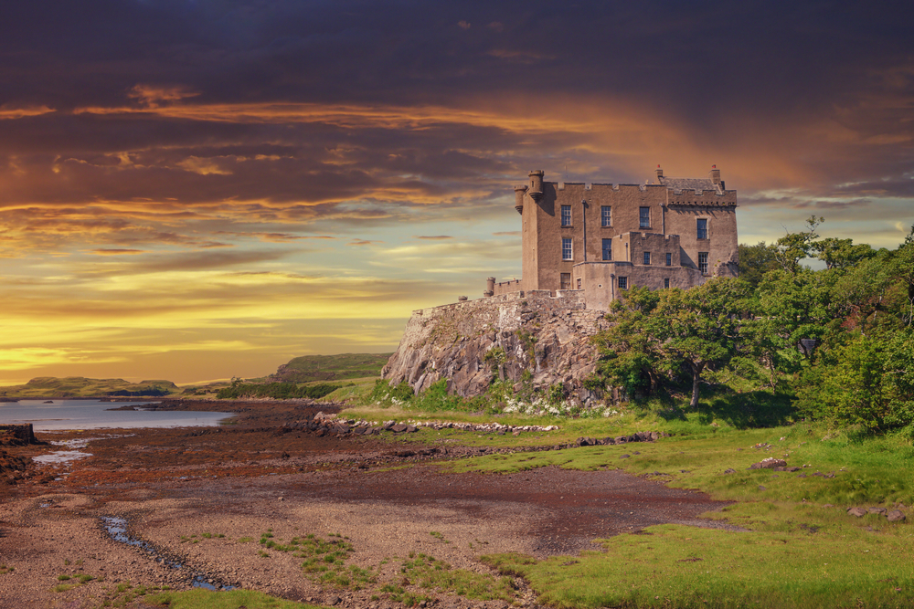 Dunvegan Castle on the Isle of Skye, one of the best places to visit in Scotland, as seen at dusk