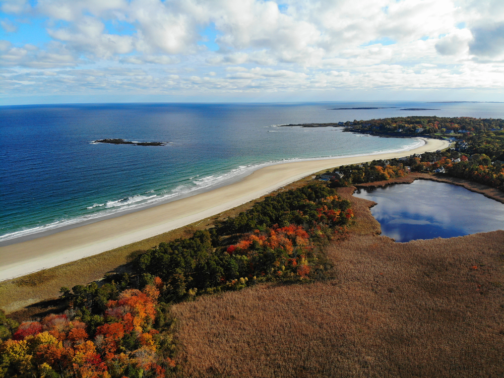 Aerial view of the beach in Portland Maine pictured during the best time to visit