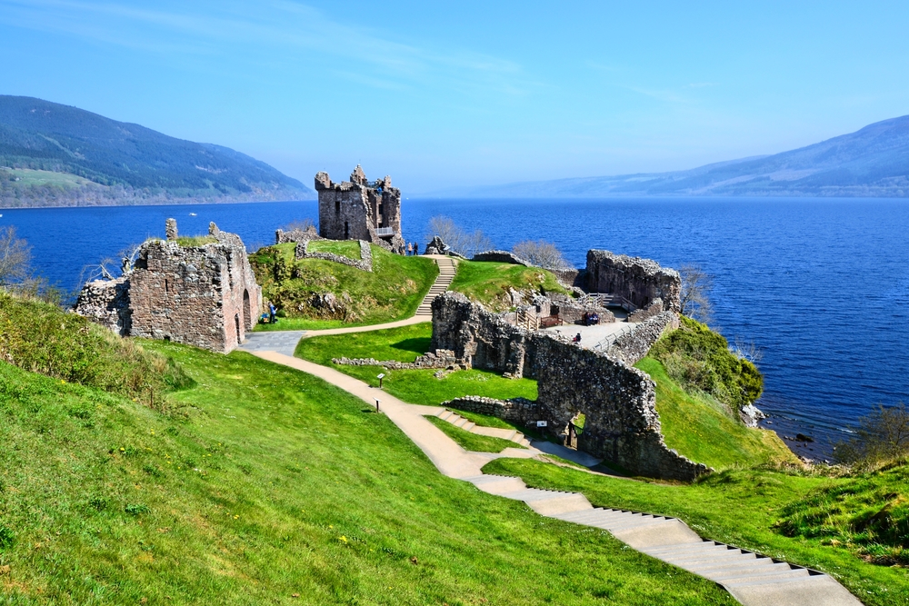 Ruins of Urquhart Castle on the coast of the lake in Loch Ness, one of the best places to visit in Scotland
