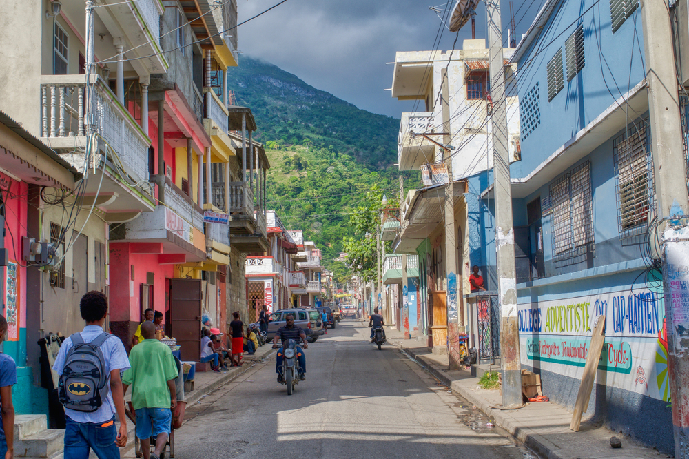 Cap-Haiten pictured with colorful buildings in the middle of the city for a piece titled Is Haiti Safe to Visit