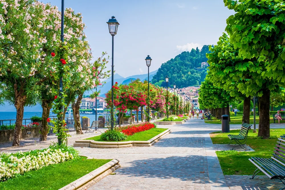 Bellagio Borgo on Lake Como pictured during the least busy time to visit with brick walkways lining the lake and a park