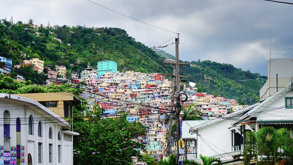 Hillside view of the colorful homes at Port-Au-Prince pictured on a cloudy day