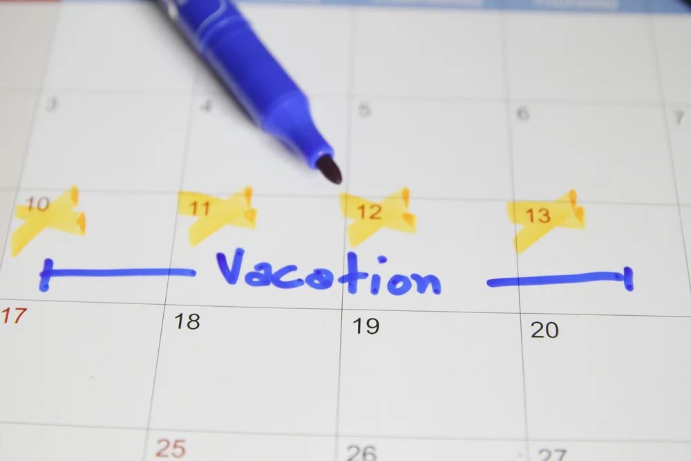 Calendar with vacation time blocked out showing when to buy travel insurance before it's too late