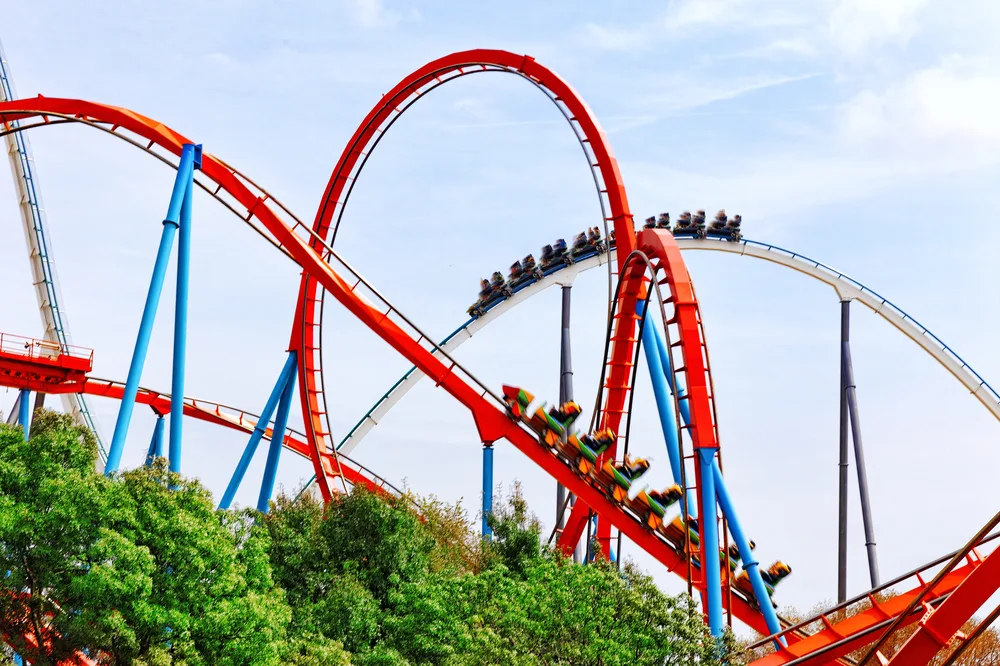 Roller coaster soaring high into the sky at PortAventura Park, one of our top picks for the top day drips from Barcelona