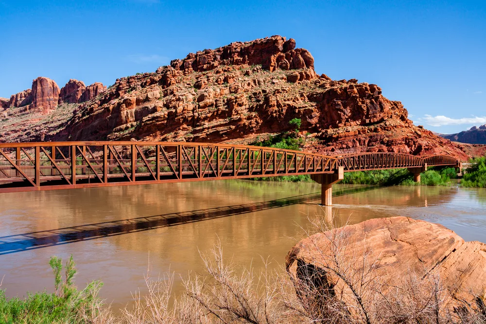 Gorgeous summer view of the Colorado Riverway Bridge in Moab, taken during the best time to visit