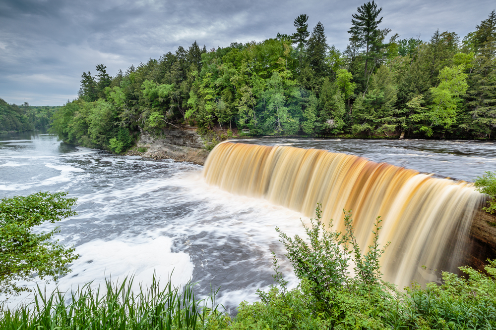 The Tahquamenon Falls on the Mississippi River pictured during the best time to visit the Upper Peninsula in Michigan