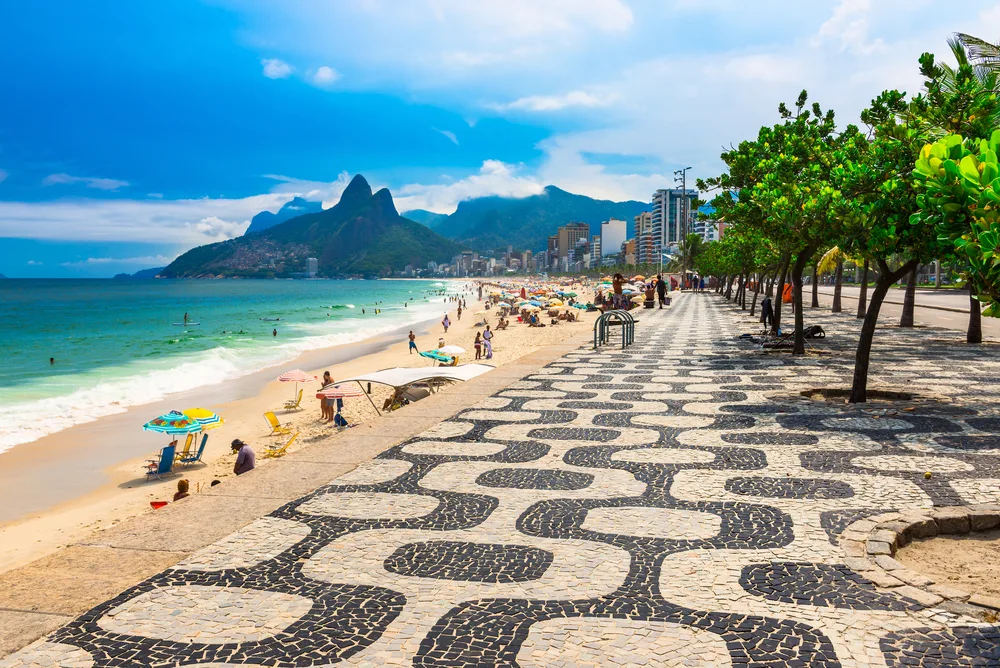 Photo of a beach and the stone boardwalk in Rio de Janeiro in Brazil, one of the best places to visit in South America