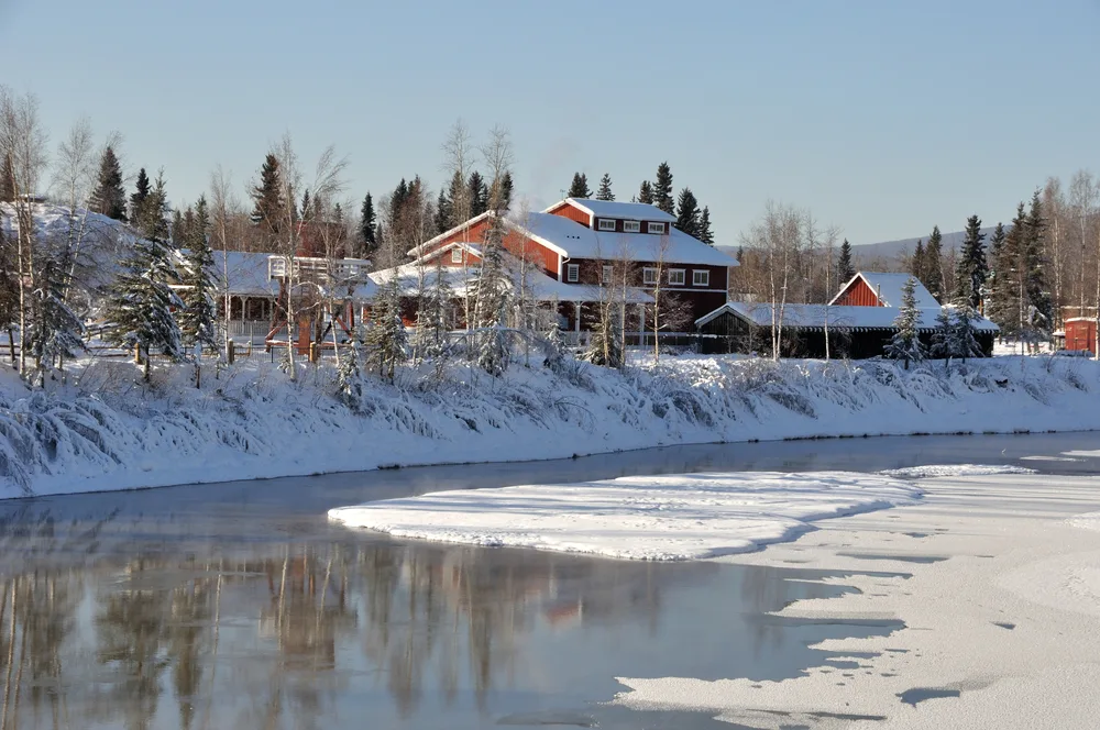 Historic Pioneer Park on the river in the winter with a clear sky, taken during the best time to visit Fairbanks Alaska