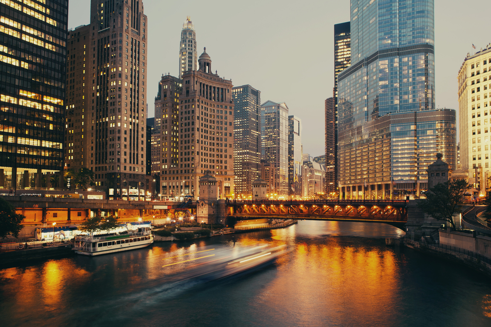 DuSable bridge across the river in Chicago, one of the best places to visit in the United States, pictured in a low-exposure image at dusk