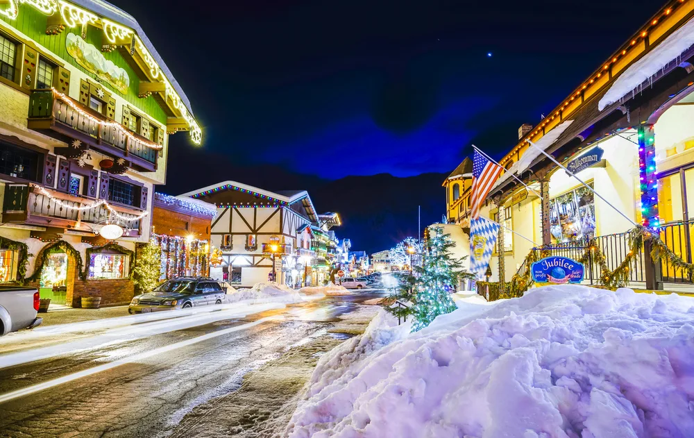 Christmas lights on the buildings and trees in Leavenworth, Washington in the winter during the best time to go to the town