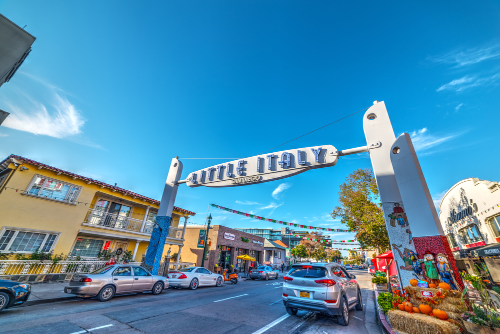 Angled view of the blue skies behind the Little Italy sign in San Diego