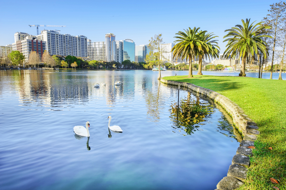 Lake Eola Park pictured in the day with ducks on the pond for a piece on the best places to visit in the United States