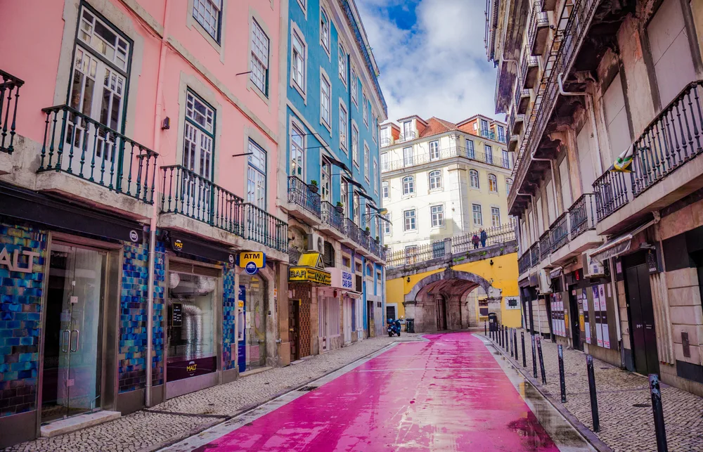 Rua Nova Do Carvalho, the pink street lined with bars, pictured during the least busy time to visit Libson in the off-season with nobody in the street
