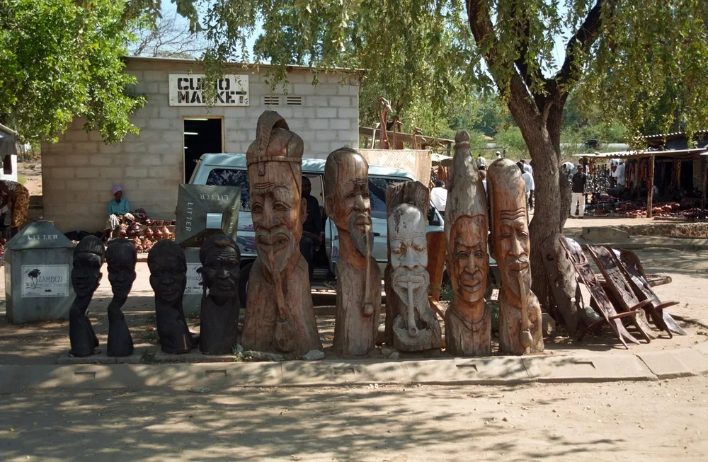 Neat view of some wooden carvings pictured during the best time to visit Victoria Falls in Zimbabwe