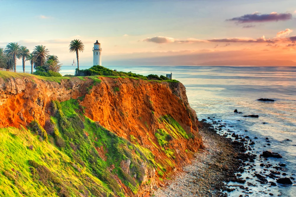 Pointe Vincent lighthouse overlooking Catalina Island pictured with red clay soil