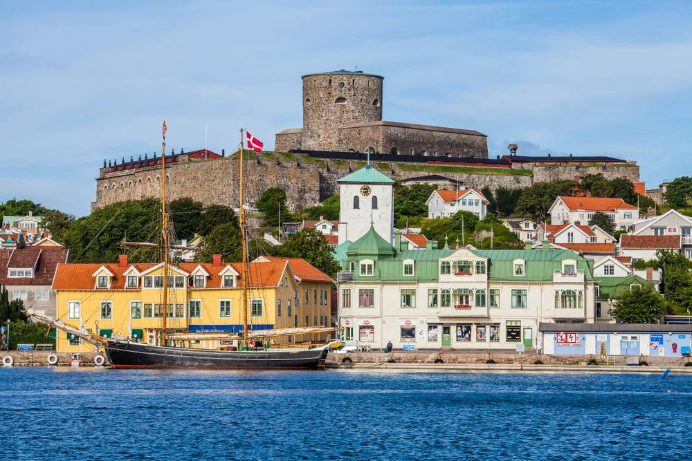 Old fortress and colorful homes and buildings in Marstrand Island, one of the must-see places to visit in Sweden