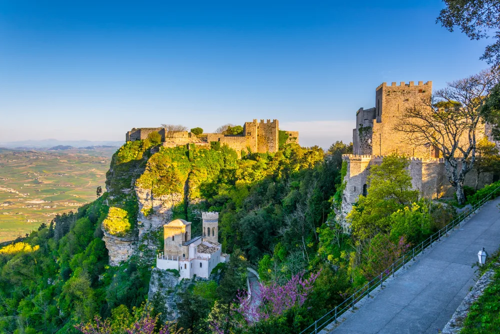 Castello di Venere in Erice, one of the best places to visit in Sicily, pictured on a clear and blue-sky day