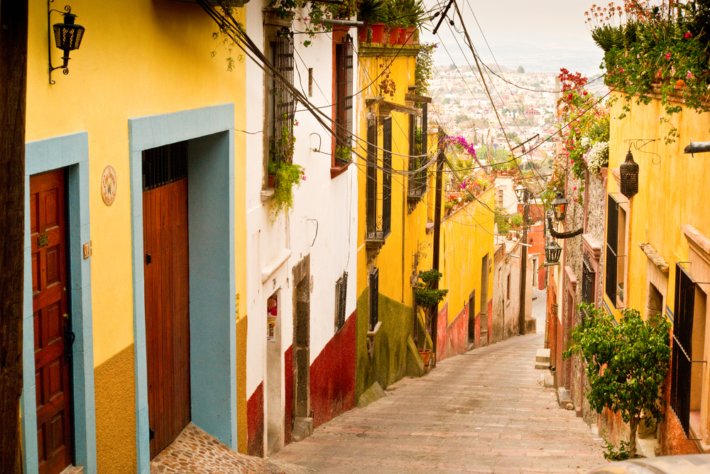 Neat and steep stone street of San Miguel de Allende in Mexico