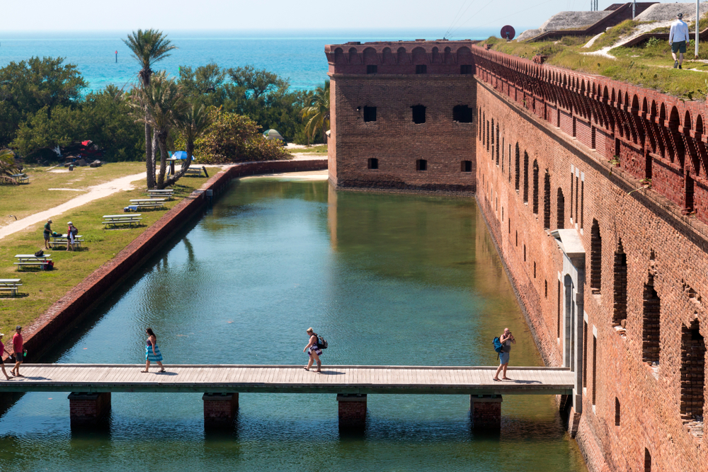 Path over the water with people walking on it pictured during the best time to visit Dry Tortugas national park