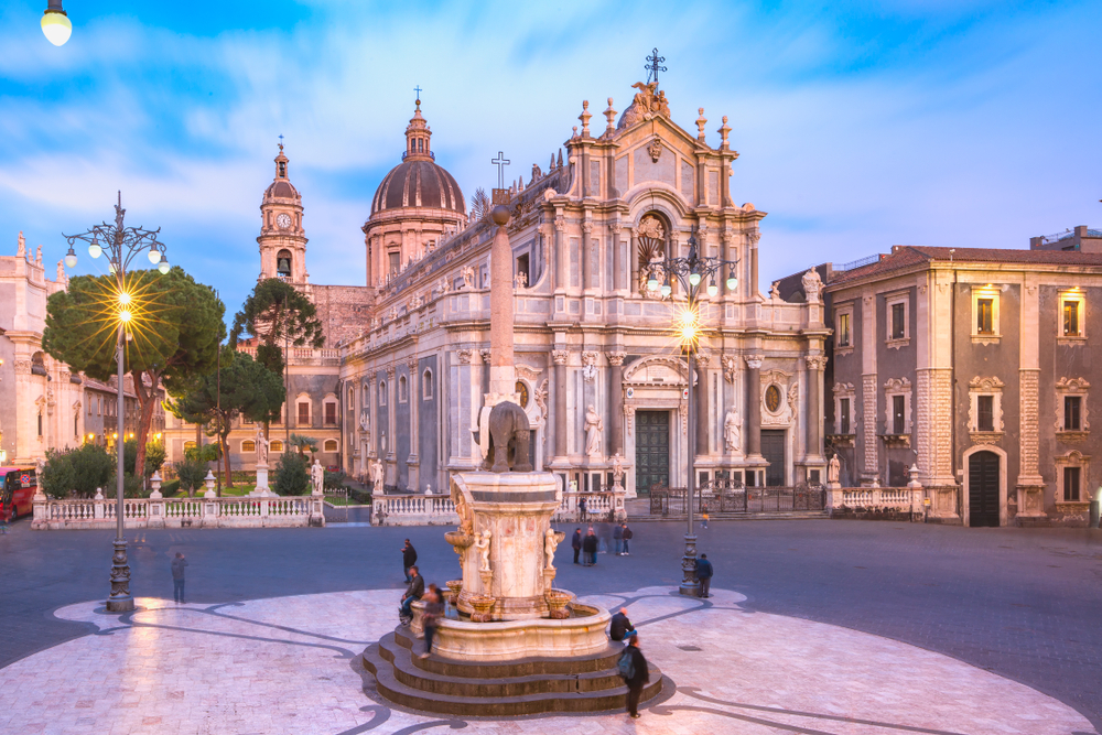 Piazza Duomo in Catania, one of the best places to visit in Sicily, as seen on a semi-cloudy day at dusk