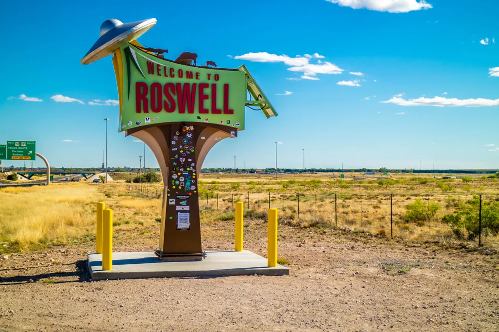Sign that says welcome to Roswell pictured on a clear day for a piece titled Is New Mexico Safe to Visit