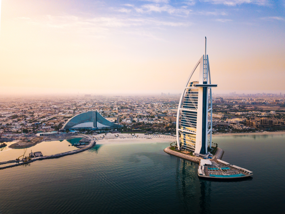 Stunning aerial view of the Burj Al Arab and the downtown skyline overlooking the ocean in Dubai, one of the best places in the world to visit in March
