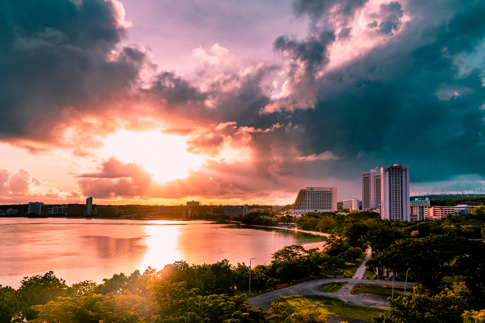 Sun rising over a few of the bigger hotels in Guam pictured during the best time to visit