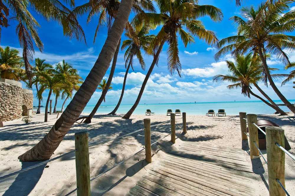 Footbridge to the white sand beach in Key West, one of the best places to visit in Florida for couples