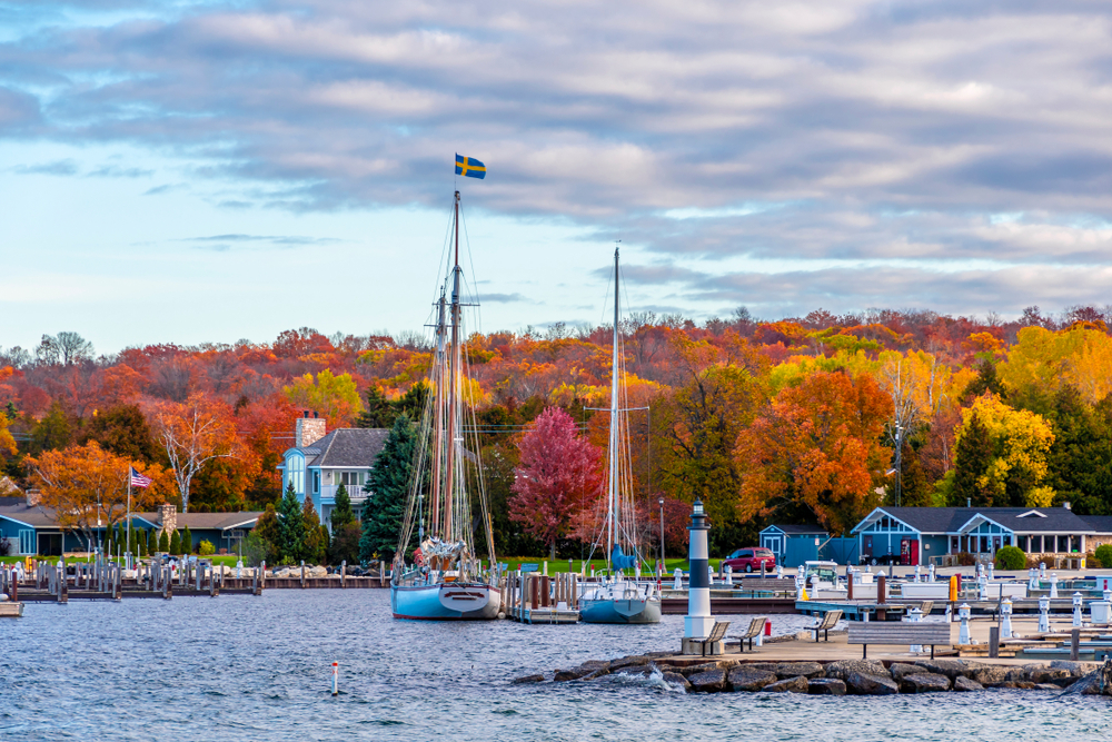 Sailboats and docks on the coast of the water of Door County, pictured during the best time to visit