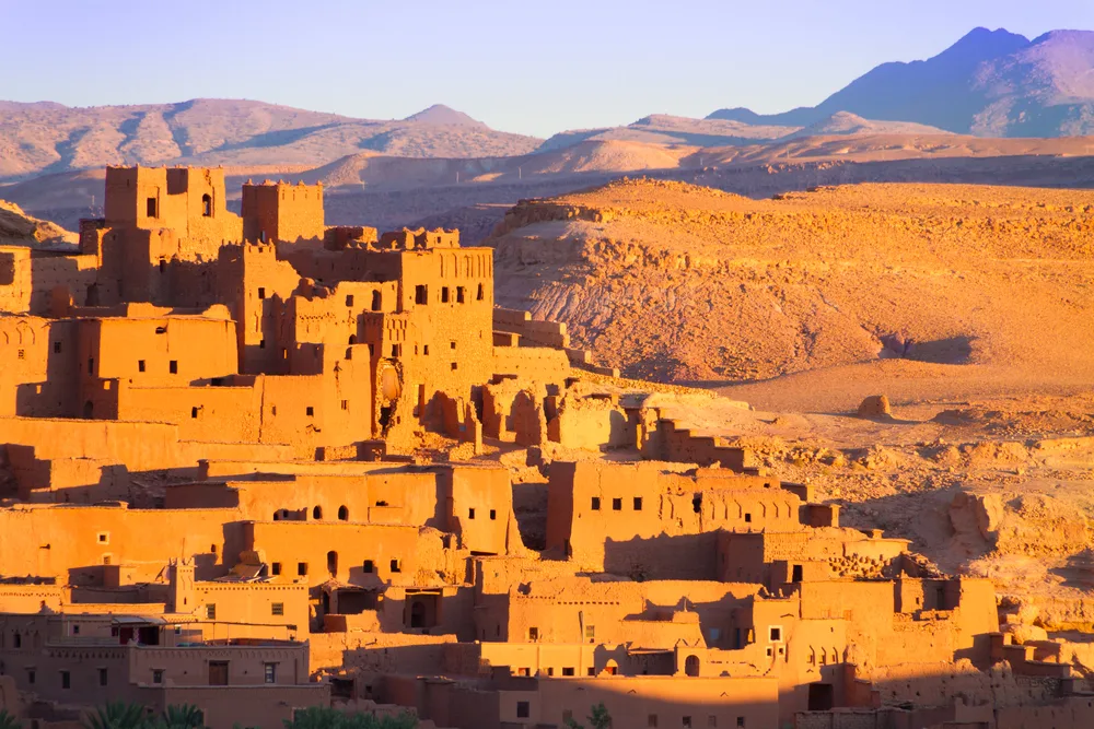 Tan clay homes in Ait Benhaddou pictured during the cheapest time to visit Marrakech