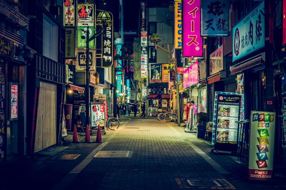For a piece titled Is Tokyo Safe to Travel to, a dark street with closed shops