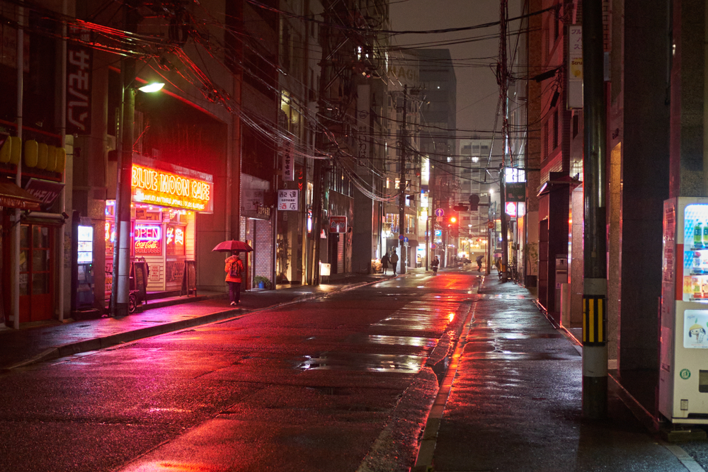 Neon sign in a dimly-lit area of Hiroshima for a piece on is the city safe to visit