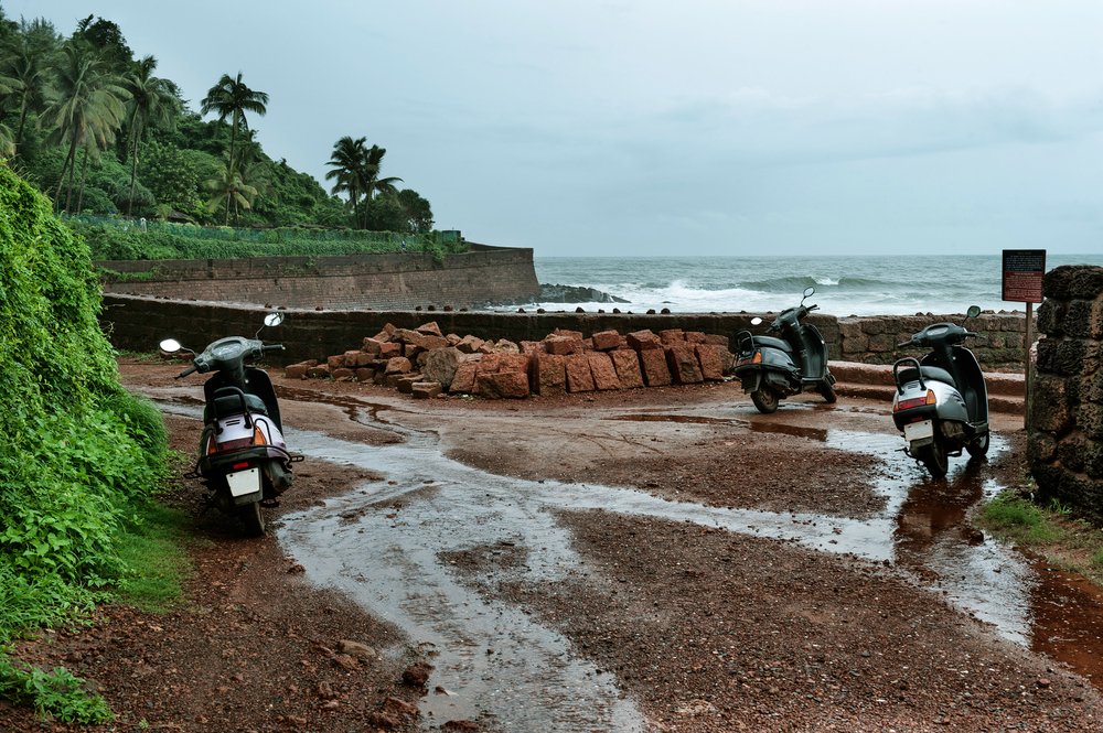 Mopeds outside of the Aguada Fort pictured during the monsoon season during the best time to visit Goa