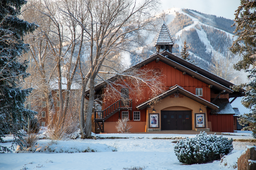 Amazing red and snowy resort of Sun Valley, one of the best places to visit in December, pictured with Bavarian-themed architecture