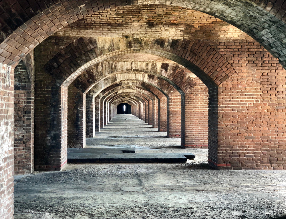 Brick arches in the hallway of Fort Jefferson during the best time to visit Dry Tortugas National Park