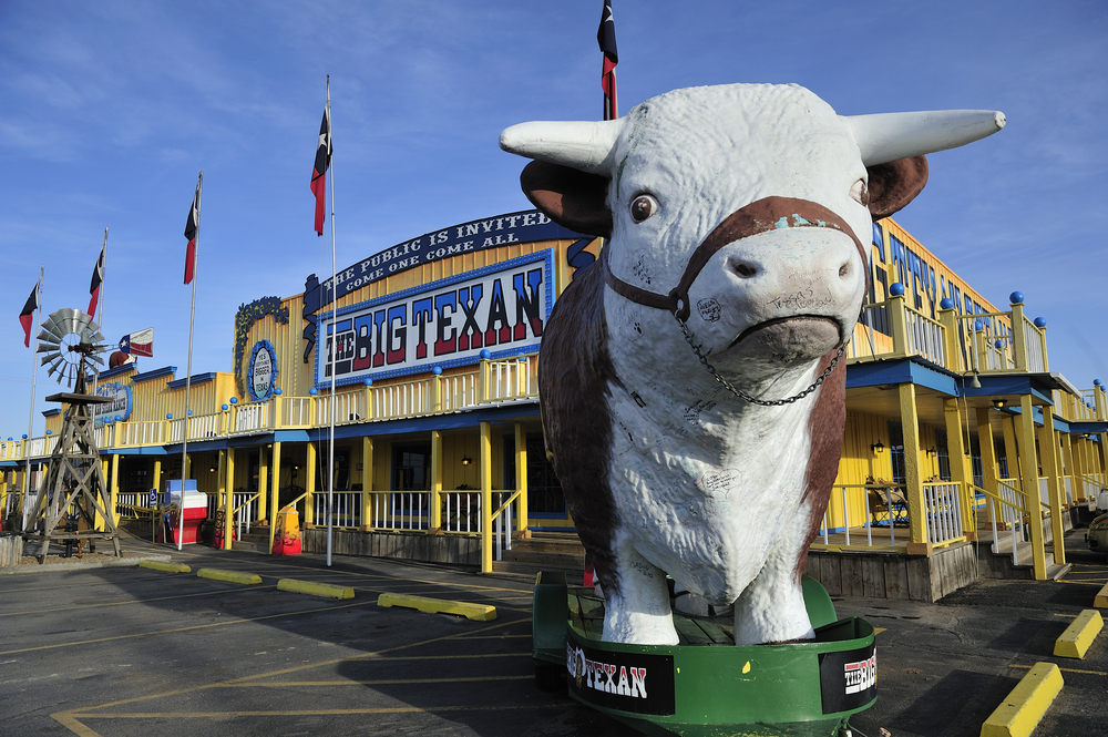 Big cow in front of the Big Texan Steak Ranch pictured in Amarillo, one of the best places to visit in Texas