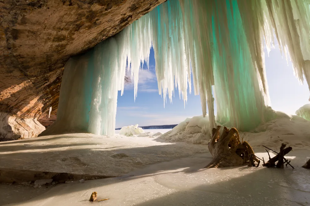 Ice stalagmites hanging from the top of the cave during the worst time to visit pictured rocks 