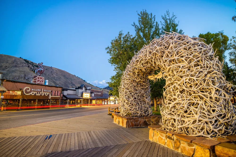 Cool view of the downtown idea in downtown Jackson Hole Wyoming, one of the best places to visit in December, on a clear-sky evening