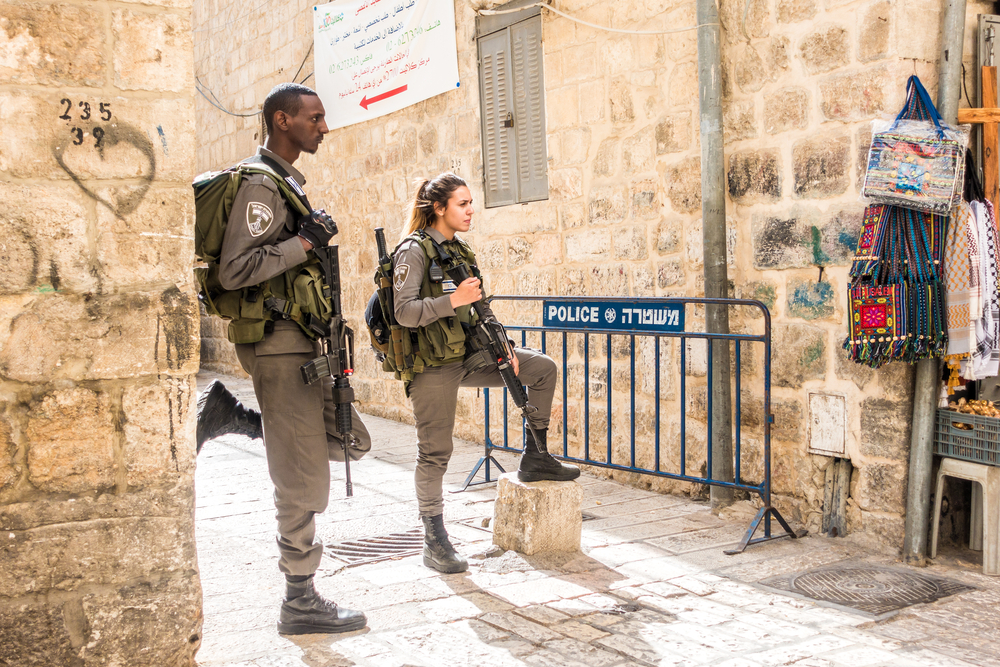 Two soldiers in Jerusalem guarding the main street in the Old City