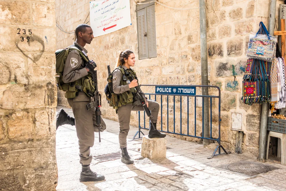 Two soldiers in Jerusalem guarding the main street in the Old City