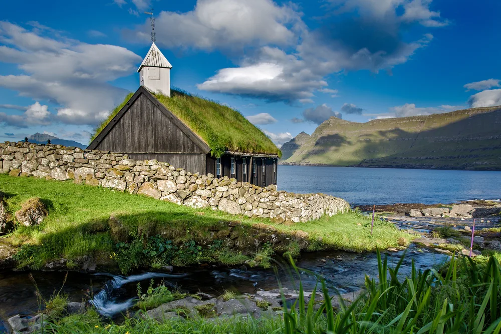 Grass-covered roof in Funningur on Eysturoy during the best time to go to the Faroe Islands