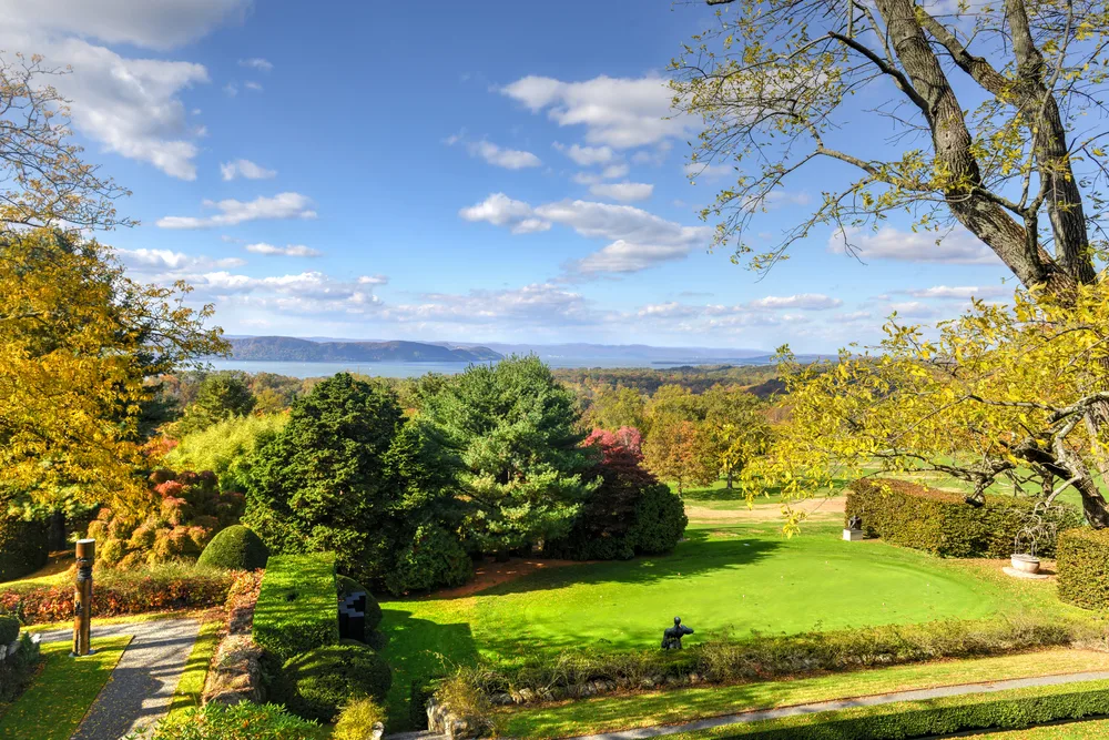 Grounds of the old Rockefeller Estate overlooking trees and a lake in Sleepy Hollow New York