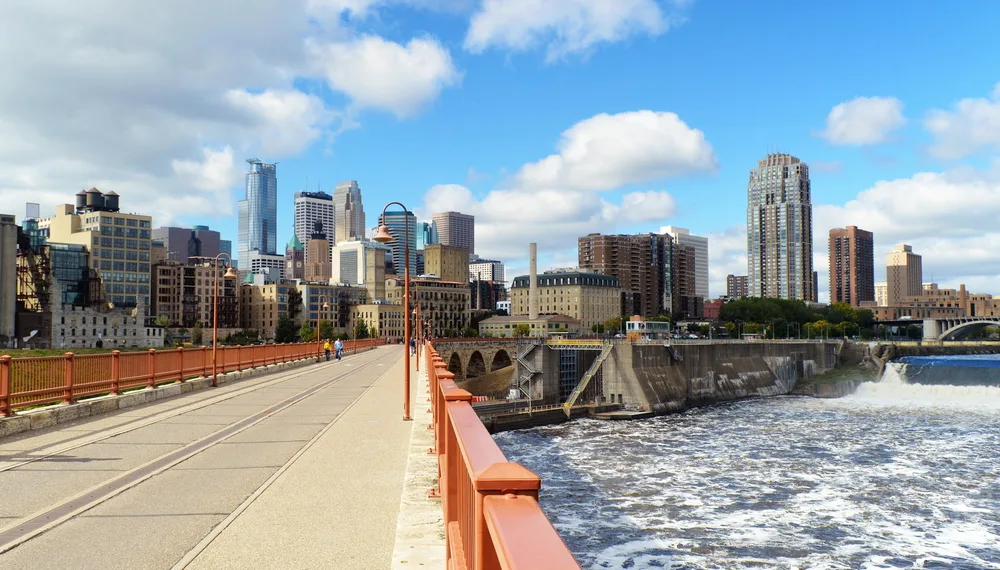 Photo of the concrete bridge over the river in downtown Minneapolis for a guide titled Best Time to Visit Minnesota