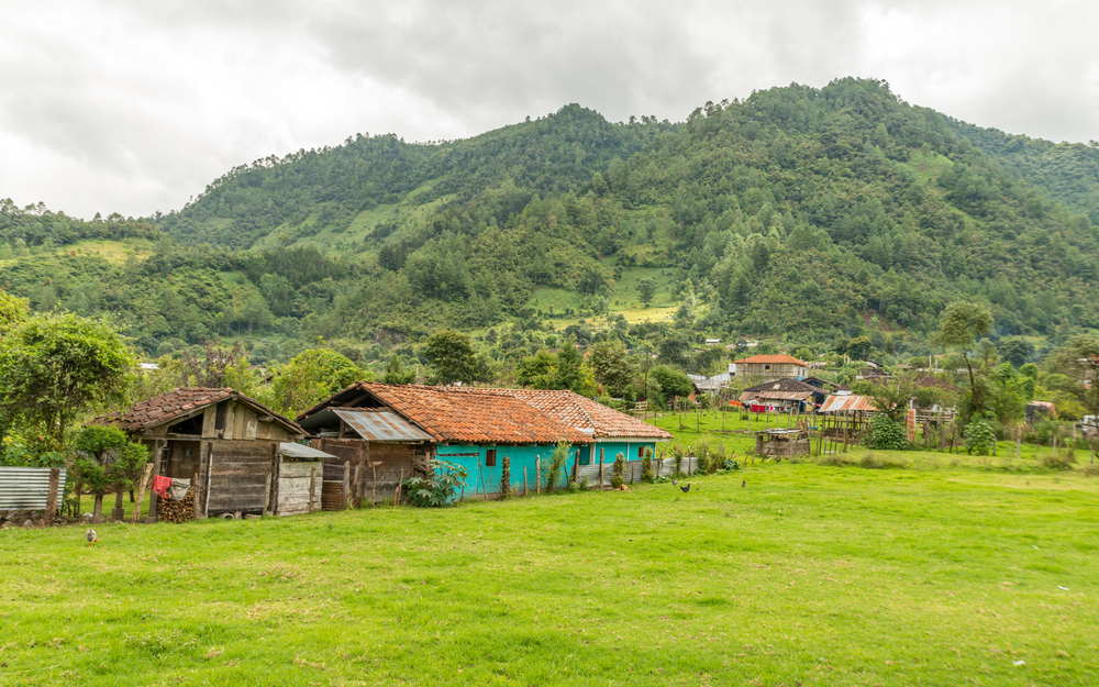 Idyllic view of the small town of Nebaj in Guatemala, seen on a cloudy day with lush green vegetation all around