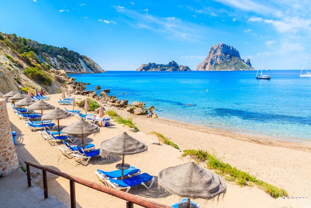 Gorgeous view of Cala d/Hort beach in Ibiza pictured during the best overall time to visit