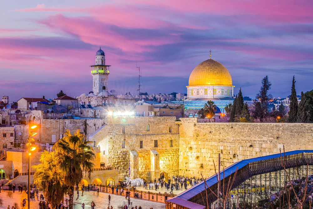 Old city and the Western Wall and the Dome of the Rock pictured at dusk