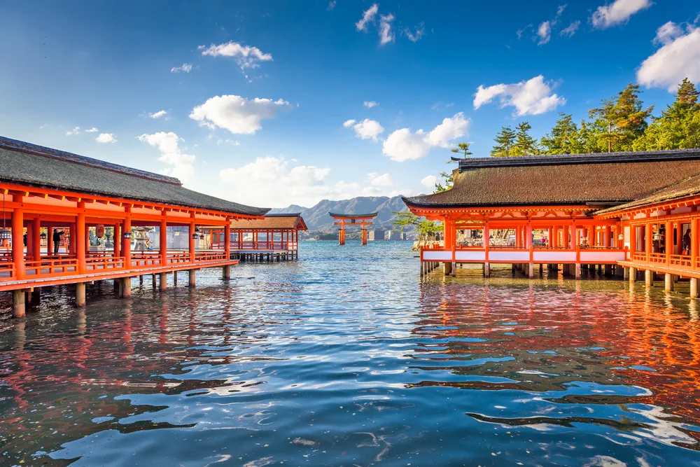 Neat view of the red over-water monuments pictured in Miyajima for a guide to whether or not Hiroshima is safe to visit