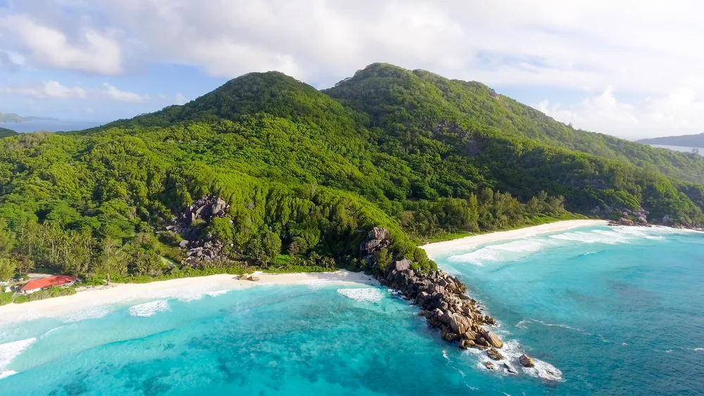 Aerial view of Grand Anse Beach on La Digue Island in Seychelles, ranked as one of the best May destinations around the world