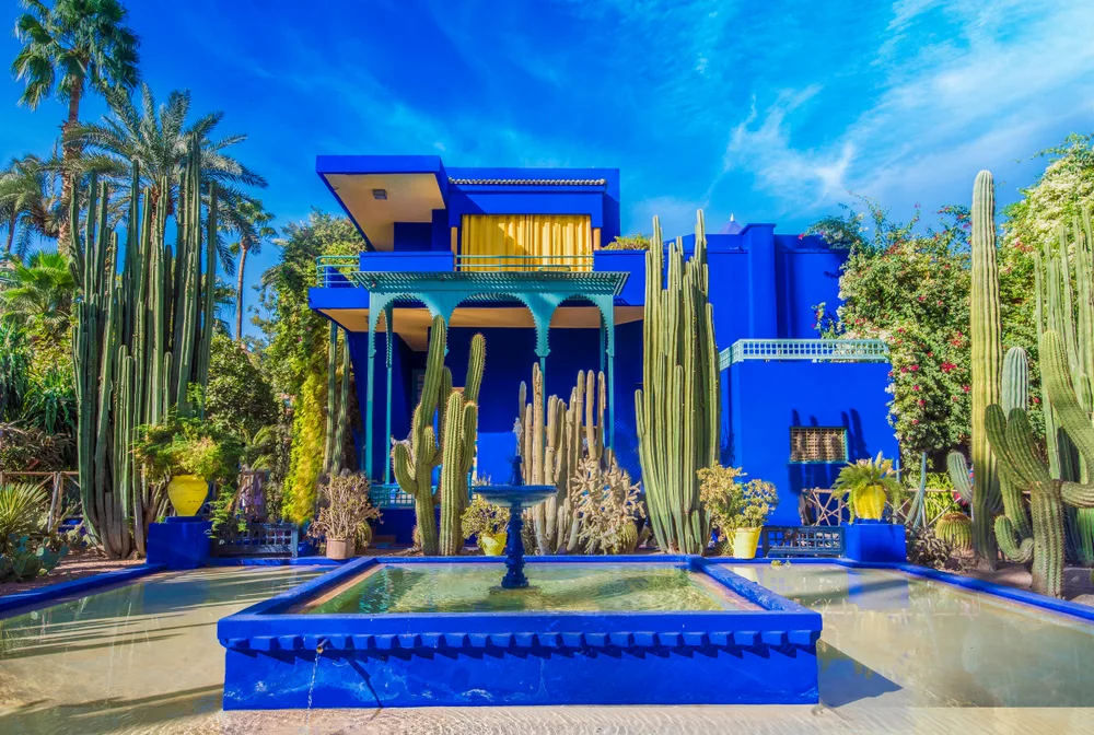 Le Jardin Majorelle, a blue home with a lush garden, pictured on a clear day during the best time to visit Marrakech