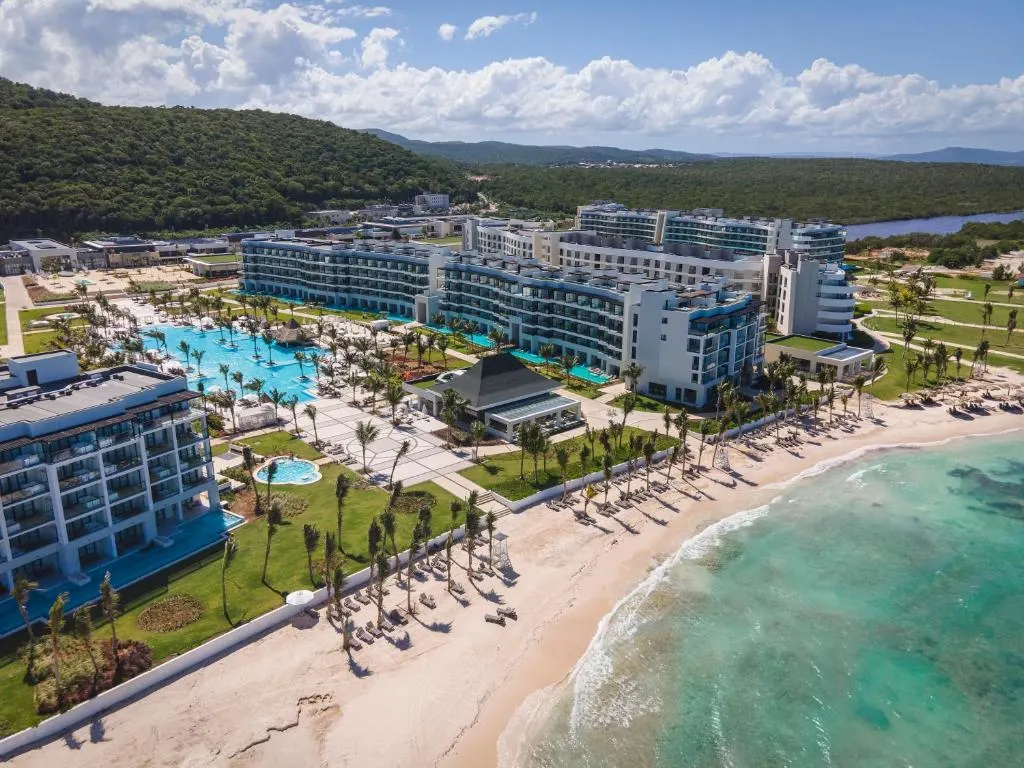 Overhead shot of the pool and beach area in the courtyard of Ocean Eden Bay, one of our top picks for the best all-inclusive resorts in Jamaica